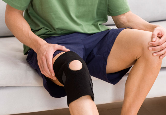 Close up of man wearing knee support