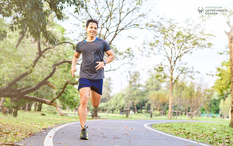 Man running on a park path